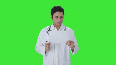 Indian-doctor-checking-medical-reports-Green-screen