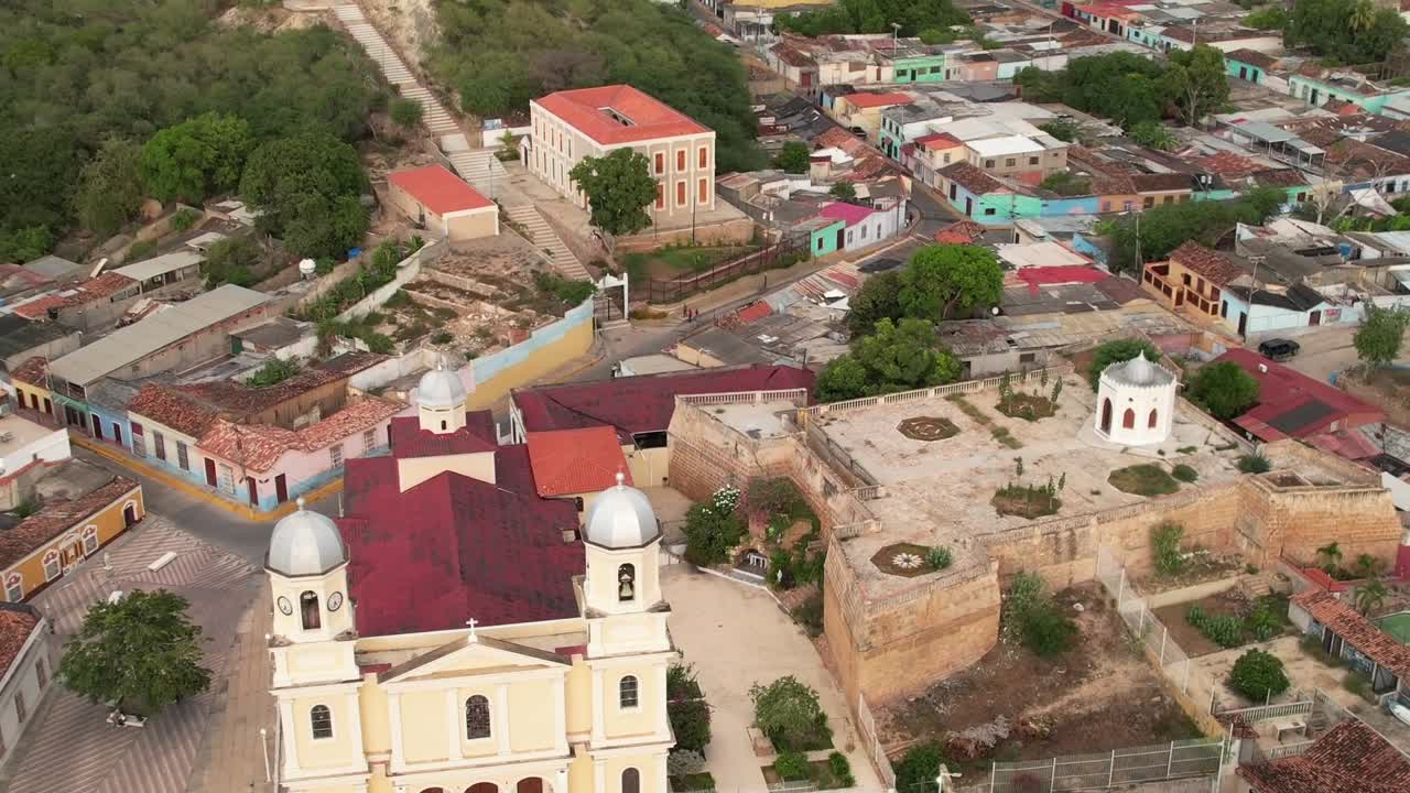 Dramatic Sunset Aerial View of Basílica Santa Inés and Historic Fortress in Cumaná, Venezuela