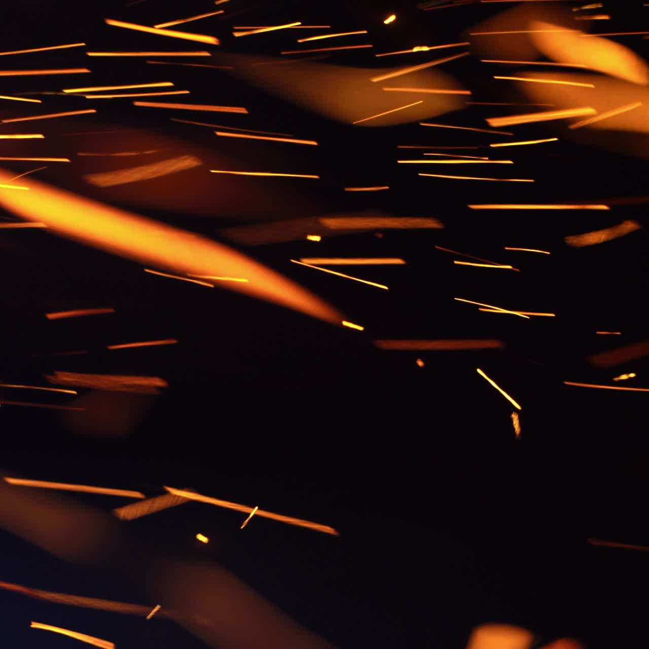 Grinding glitter manufacturing. Grinder sparks flying pattern