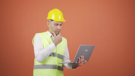 engineer working on project on laptop.