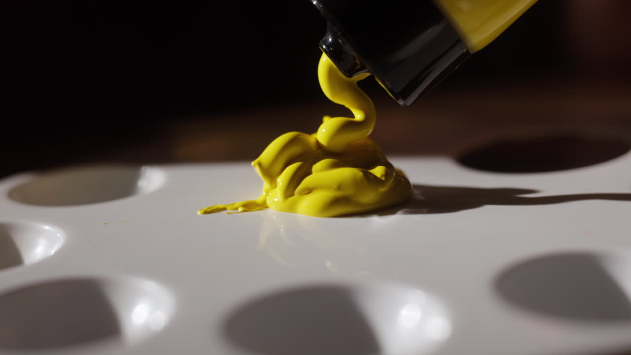 Yellow Paint Pouring on Artist Palette