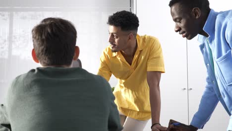 startup founders discussing business strategy in office meeting