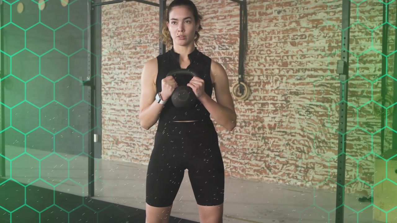 Starting from bottom squat, adult woman doing kettlebell goblet squats, driving hips for strength