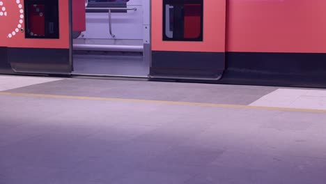 subway train arrives at station, doors open and close, nobody is there