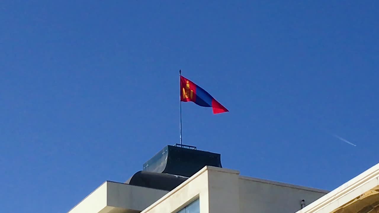 Mongolian Flag Flying On Top Of Government Palace At Sukhbaatar Square