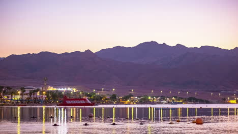 Ferry-Boat-And-Mountains-On-Sinai-Peninsula-Coast-At-Sunset-In-Dahab,-Egypt