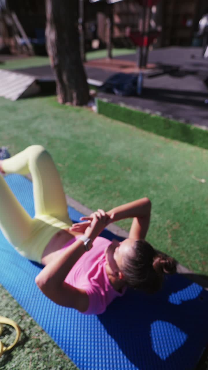 Woman doing yoga and stretching outdoors