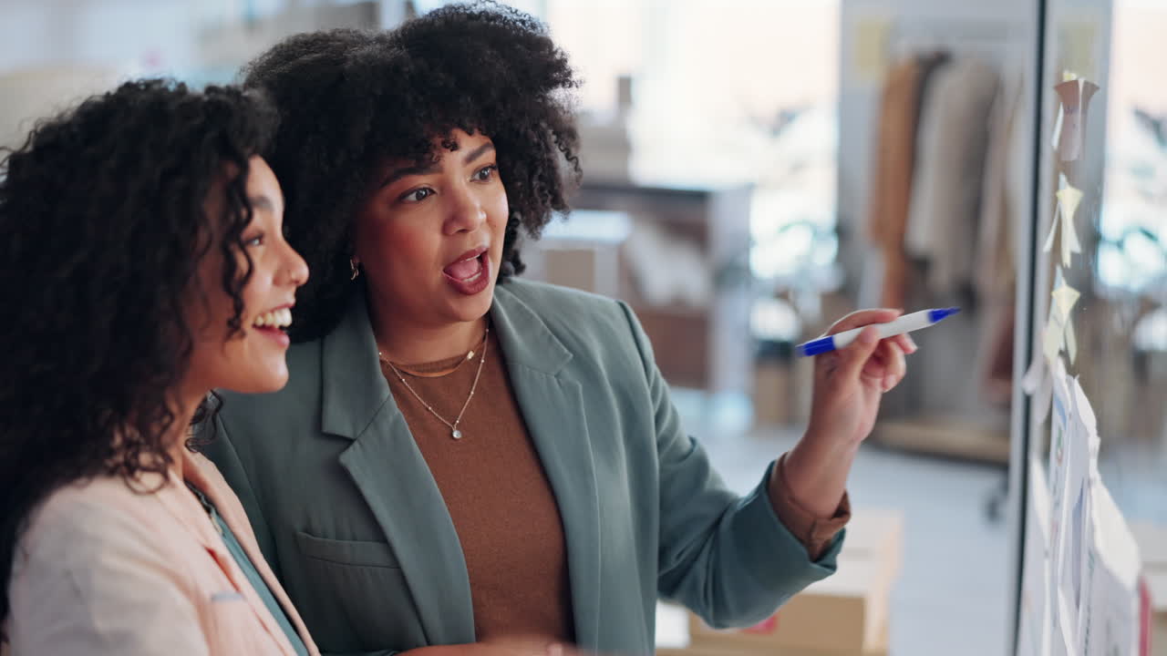 Designer writing, women teamwork