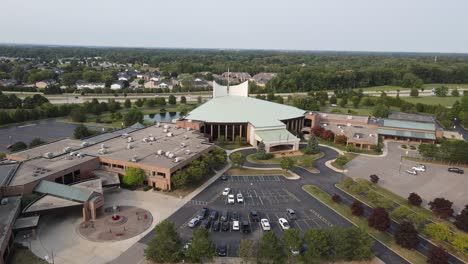 Church-building-with-massive-parking-lot-in-USA,-aerial-drone-view