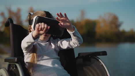 child with spinal cord injury plays game wearing vr glasses