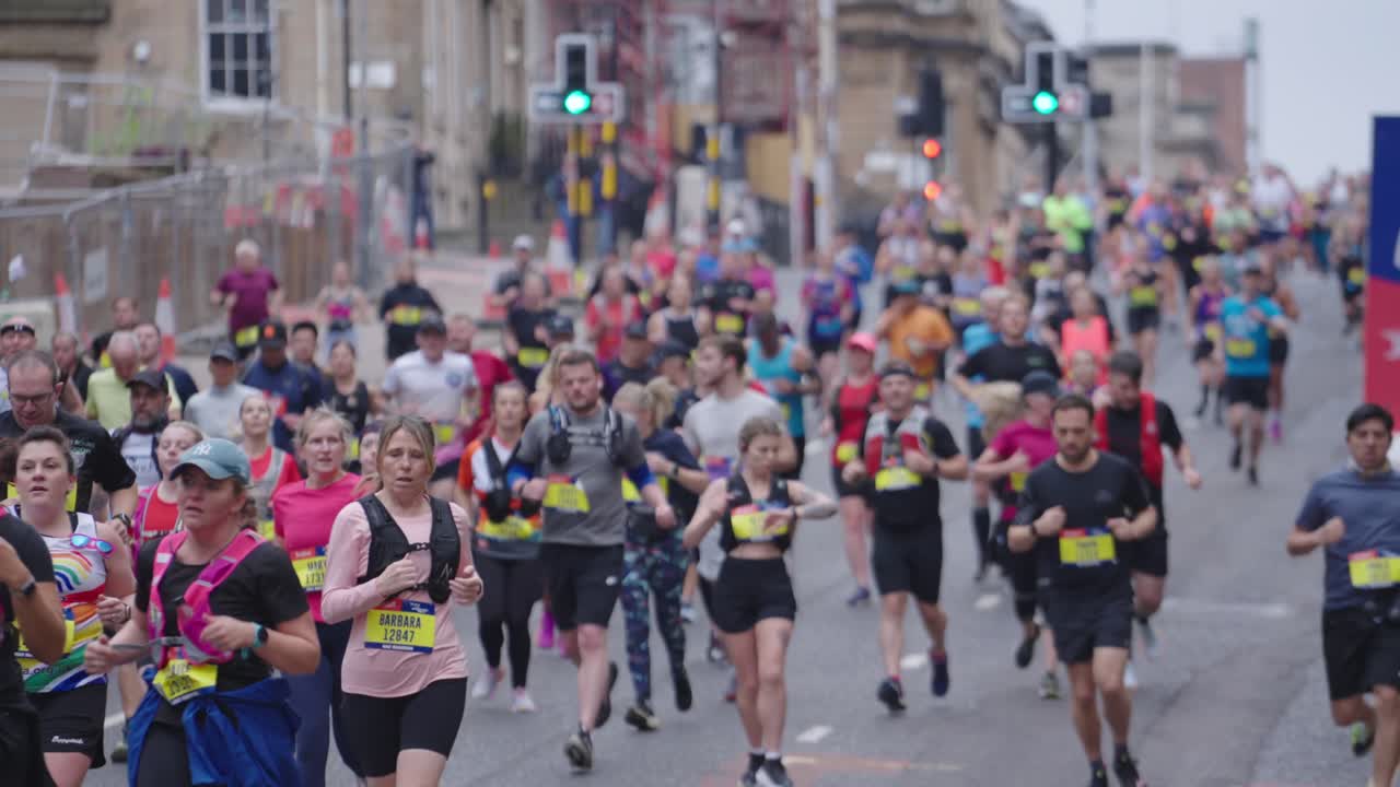 Running people racing, Scottish event, city location, slow motion