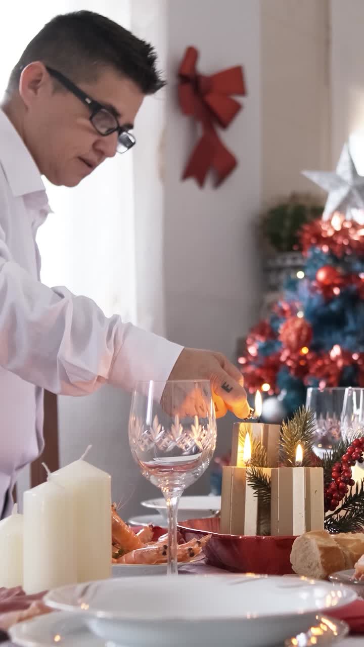 Non-binary person lighting the candles on a Christmas table