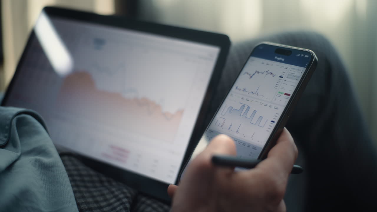 Close up happy attractive bearded businessman sit at desk working smiling and dance success on work. Use laptop at night office