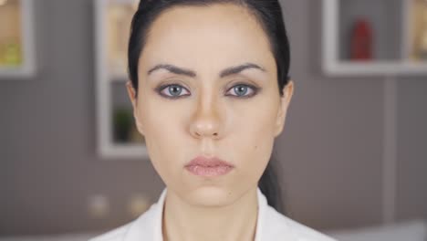 woman with blue eyes looking at camera.