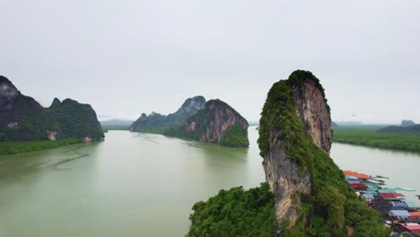 Limestone-Cliffs-at-Panyee-Island-with-Scenic-Landscape-and-River-Flowing-into-the-Phang-Nga-Bay,-Thailand