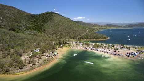 aerial parallax view of busy coastline at lake somerset in queensland