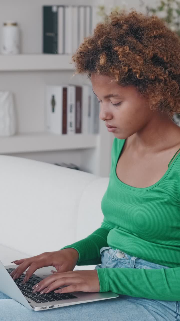 Young woman immerses herself in creative writing at home in cozy atmosphere