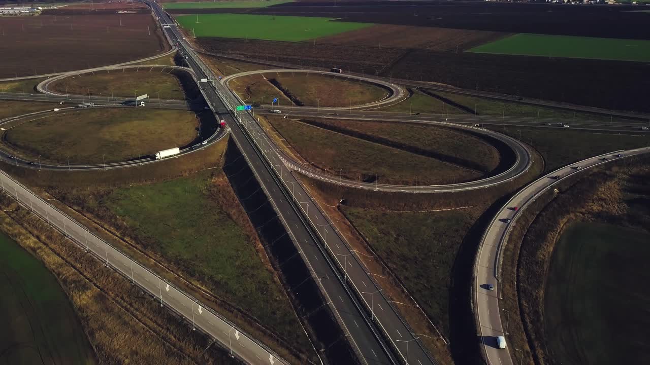 Road junction with traffic shoot on sunset