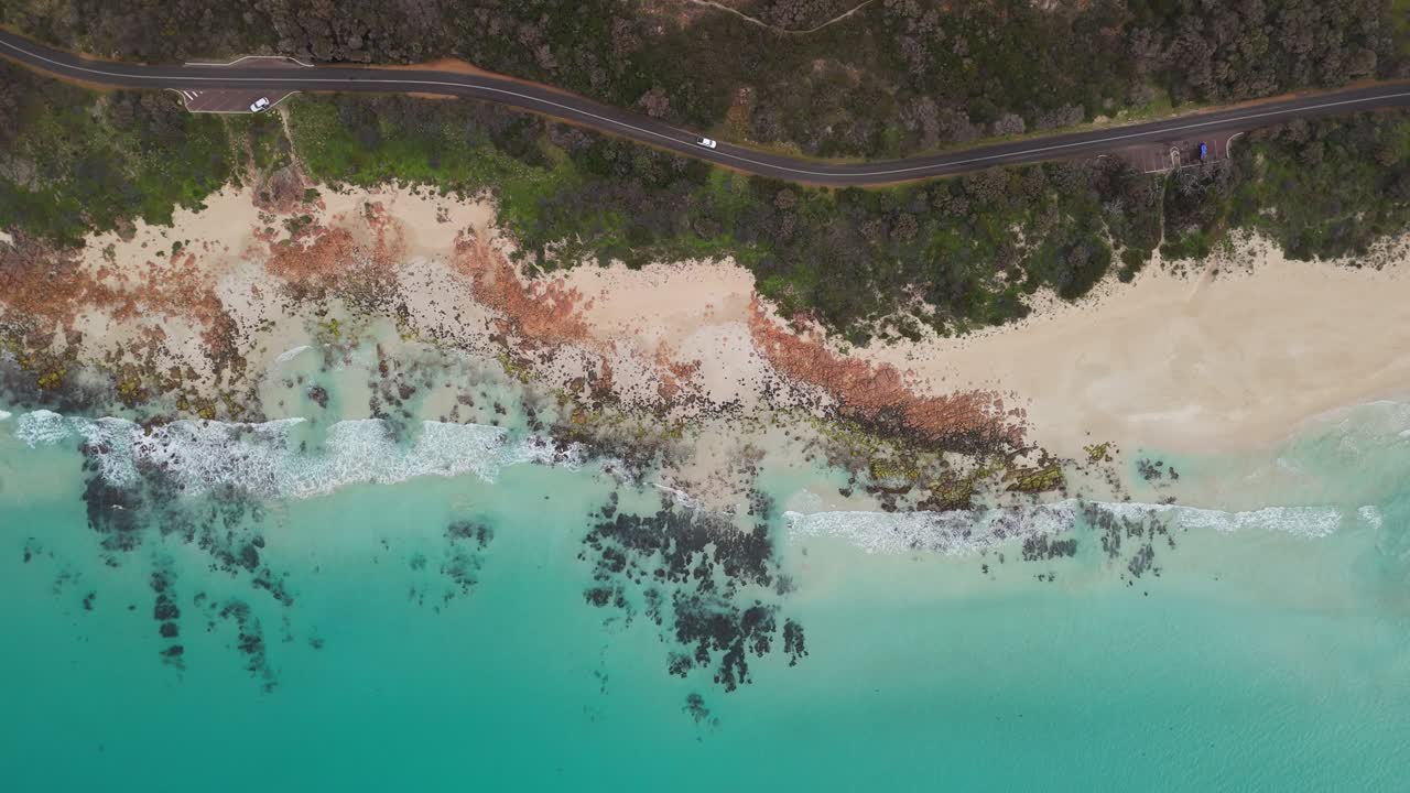 Aerial View of a Stunning Coastal Road and Turquoise Beach