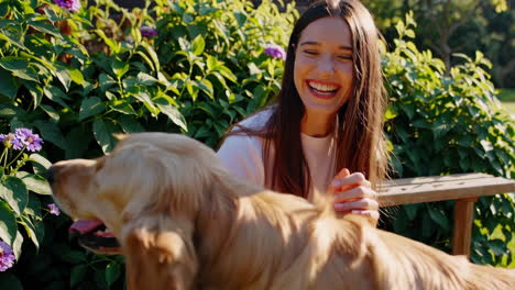 woman and dog in a garden