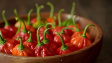 fresh chili pepper in a wooden bowl