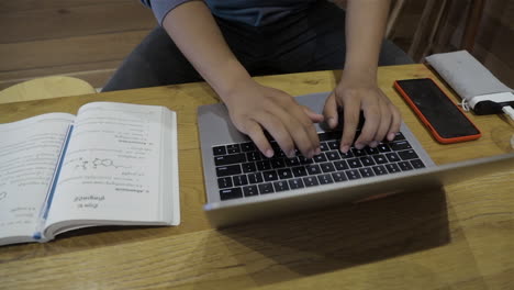 a college student preparing his document before exam.