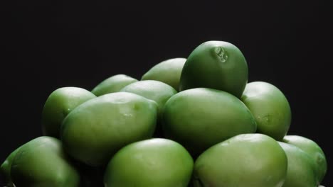 pickled round green olives from greece as background, top view. high quality 4k footage