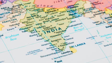 close-up of the country word india on a world map with the detailed name of the capital city