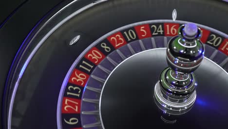 precise roulette wheel rotation capturing spinning ball trajectory landing randomly on numbered slot during high-stakes gambling moment