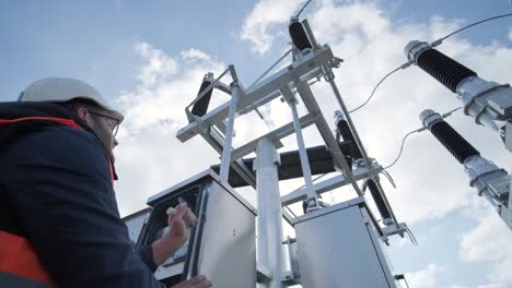 setting up equipment at a transformer substation. construction of a transformer substation