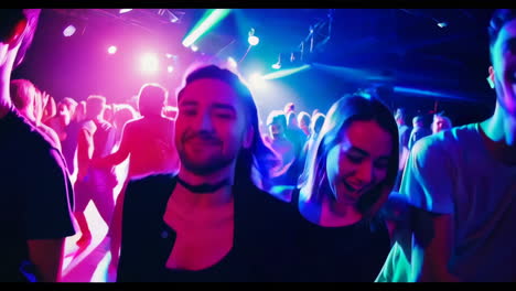 people dancing and having fun at a nightclub