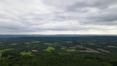 Hazlemere-countryside-on-cloudy-day,-England.-Aerial-forward