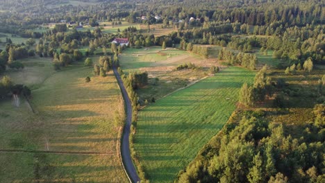 Beautiful-countryside-during-sunset-and-house-in-the-middle-of-the-field