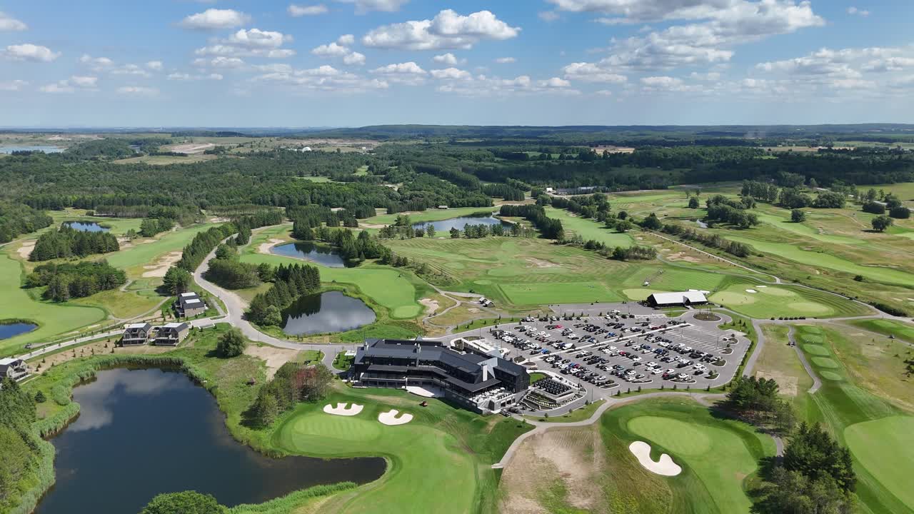 High drone shot showing TPC Toronto at Osprey Valley golf course with clubhouse, lakes and valley