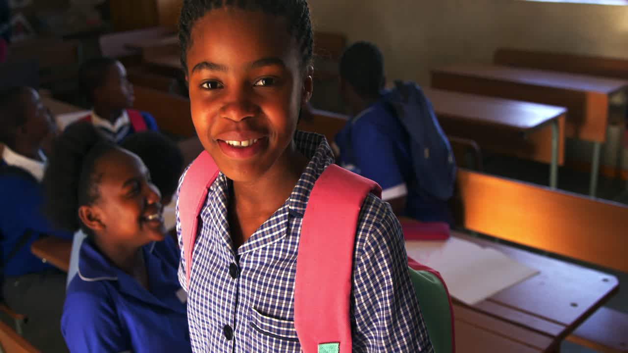 Portrait of a young schoolgirl smiling 4k