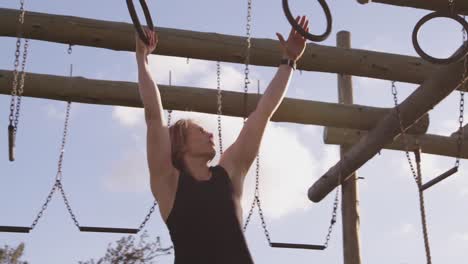 Young-woman-training-at-an-outdoor-gym-bootcamp