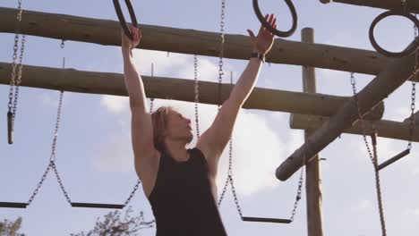 Young woman training at an outdoor gym bootcamp