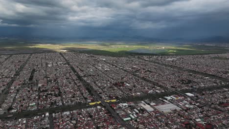 aerial drone footage of northern mexico city on a hazy afternoon