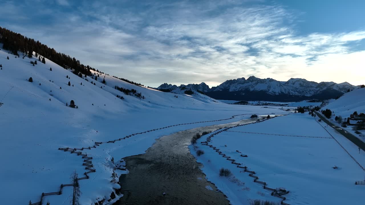 Frozen Landscape And Flowing River With Wooden Fence In Sawtooth Mountains, Sun Valley, Central Idaho