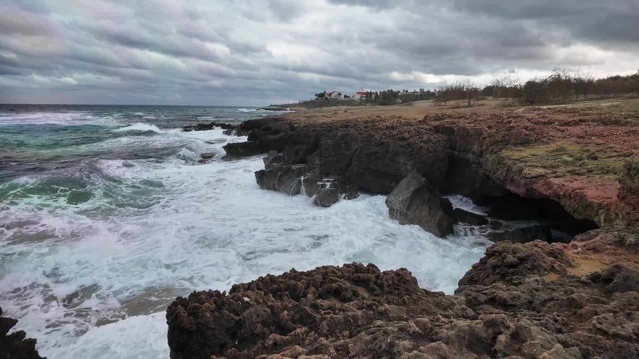 Rocky coastline with waves crashing against the shore