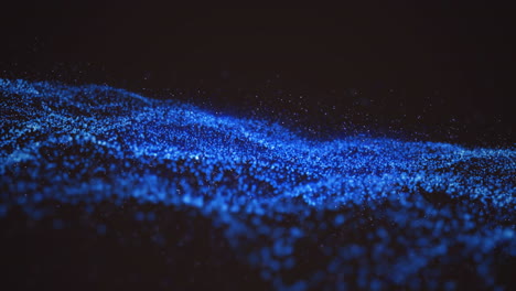 animación de manchas de luz azul sobre un fondo negro.