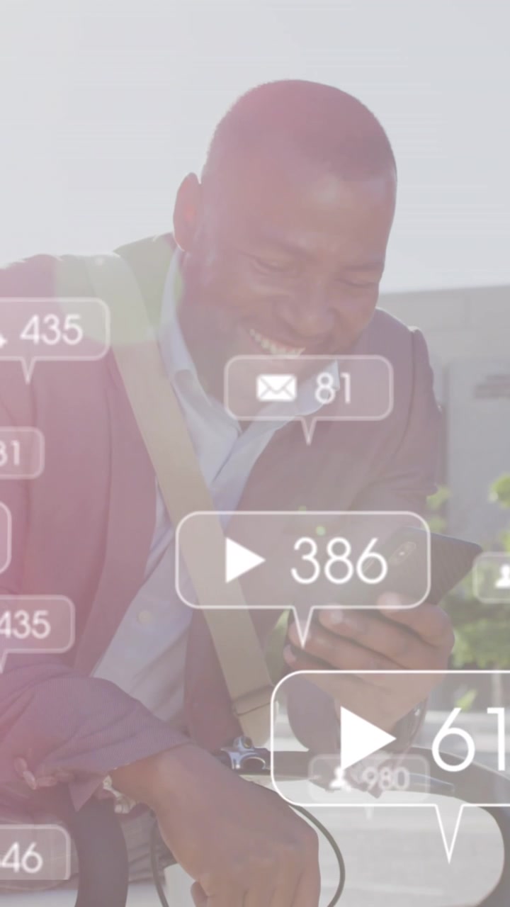 Animation of social media icons over african american man using smartphone on his bike outdoors