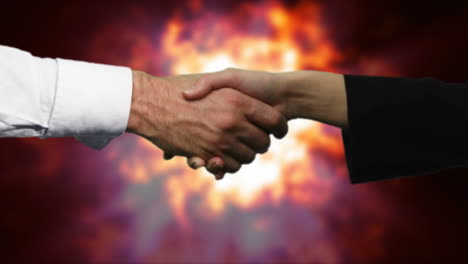 Handshake-Mit-Explosion-Im-Hintergrund