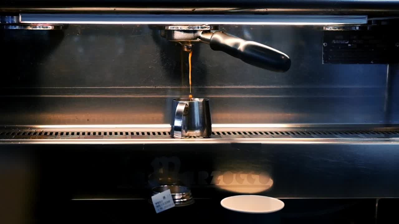 epic slow motion for making hot coffee shot at cafe