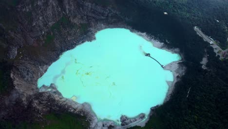 kawah putih - sulfur rich volcanic crater lake in ciwidey, bandung, west java, indonesia - aerial drone shot