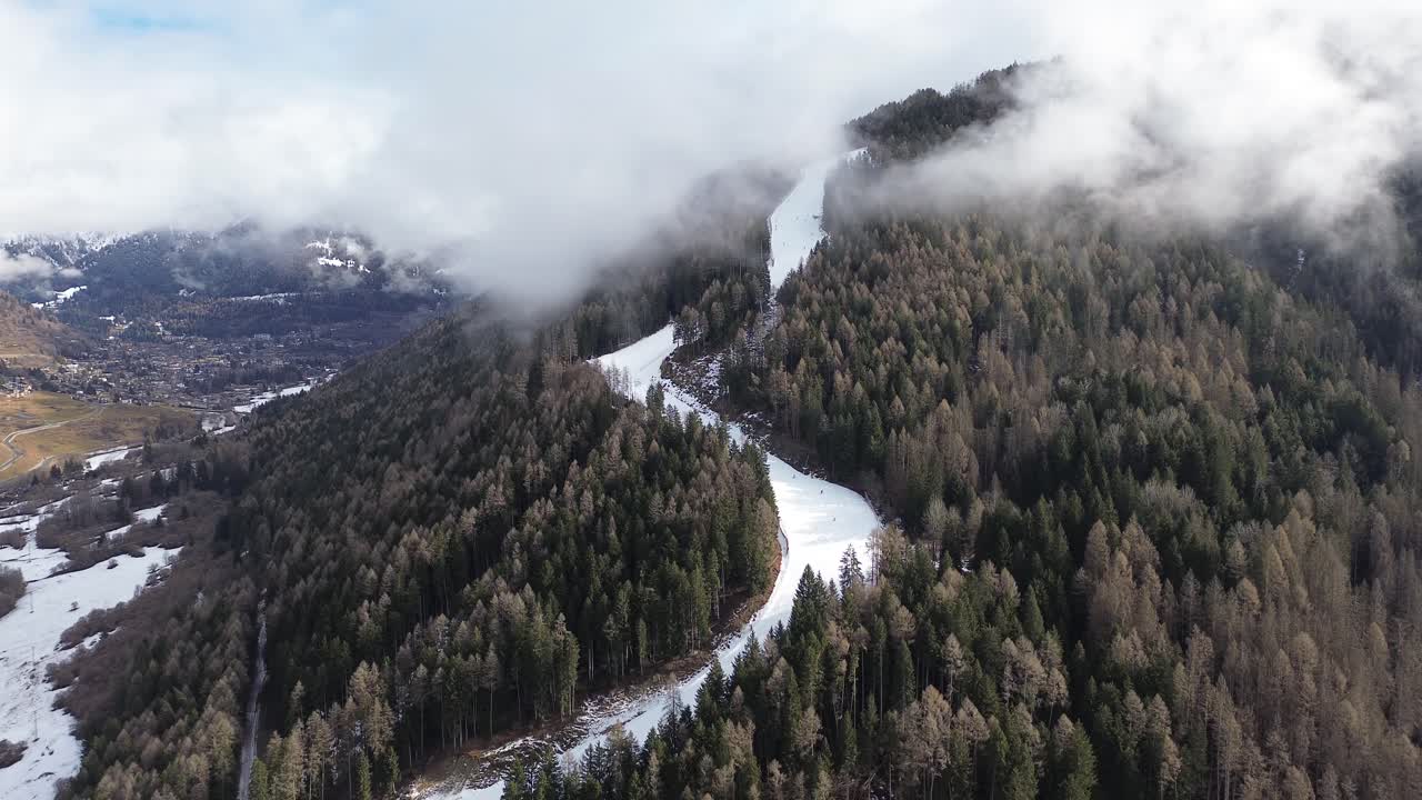 This is a large ski area that prepares Cortina 2026 in Italy. The locations are captured with a drone that shows the beauty of winter sports that combine blue sky, white snow and