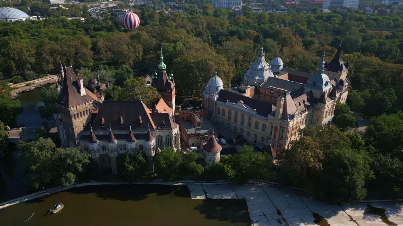 Aerial view of Vajdahunyad Castle in Budapest surrounded by greenery