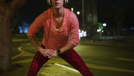 Young-woman-stretching-before-running