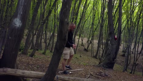 man making firecamp in the forest