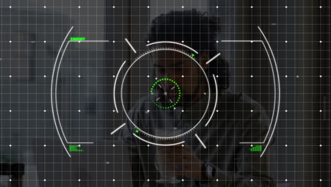 Animation of scope scanning over biracial man having coffee while working at office